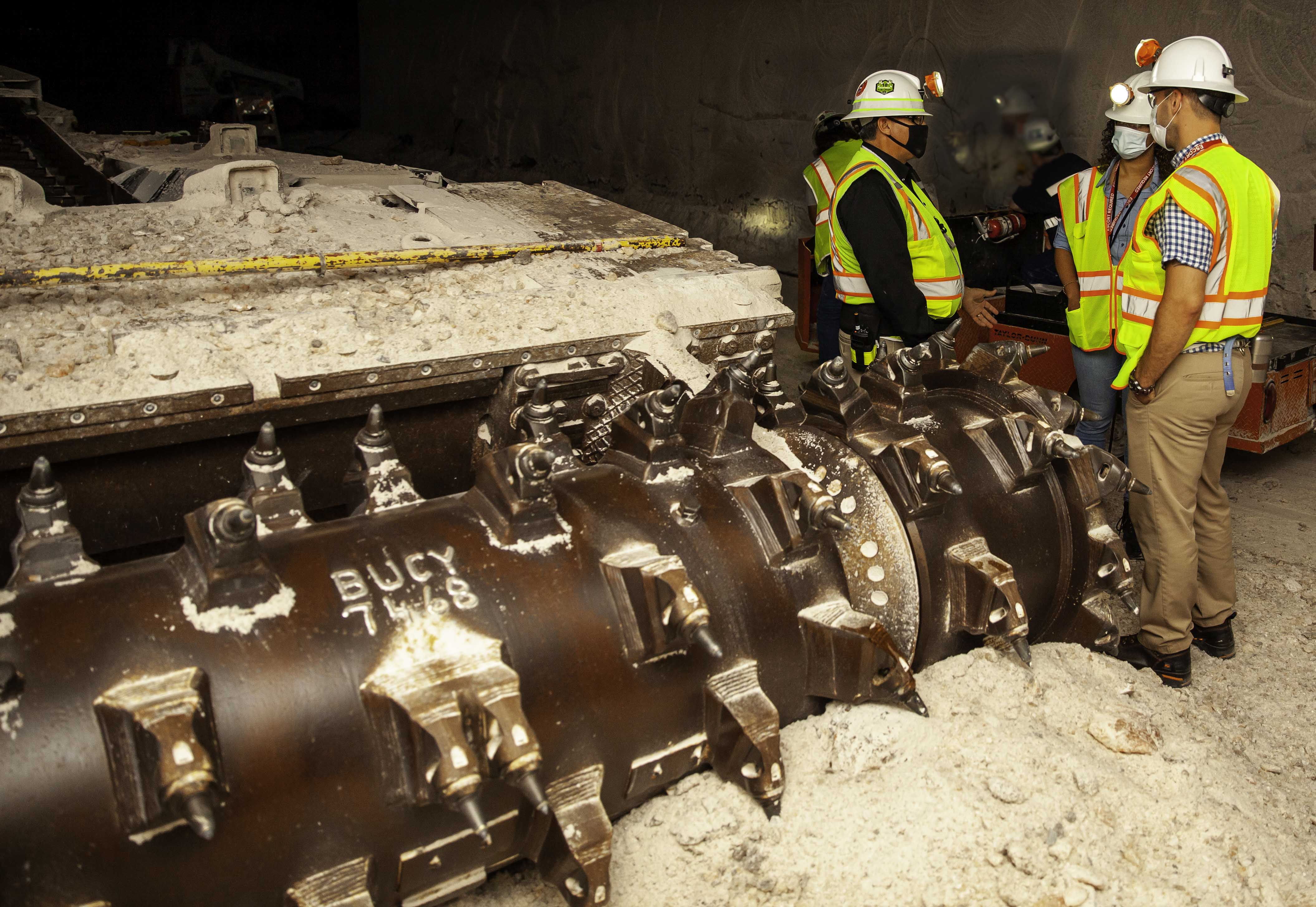 Photo of WIPP employees underground.